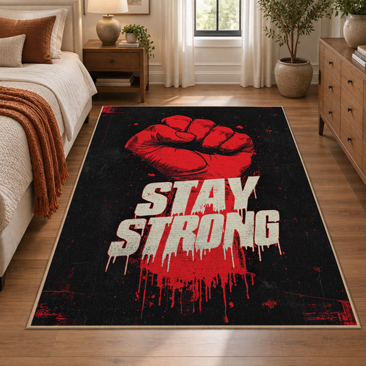 Stay Strong Graphic area rug displayed in a bedroom