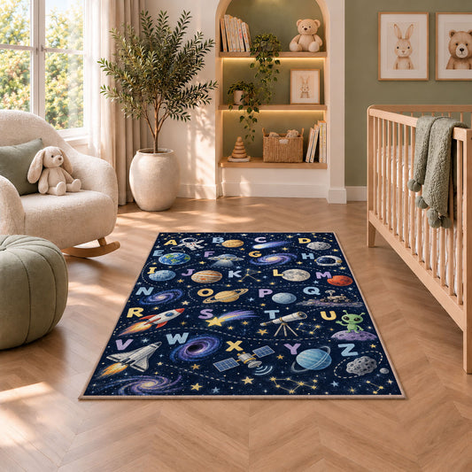space alphabet adventure rug displayed in a nursery beside an upholstered chair