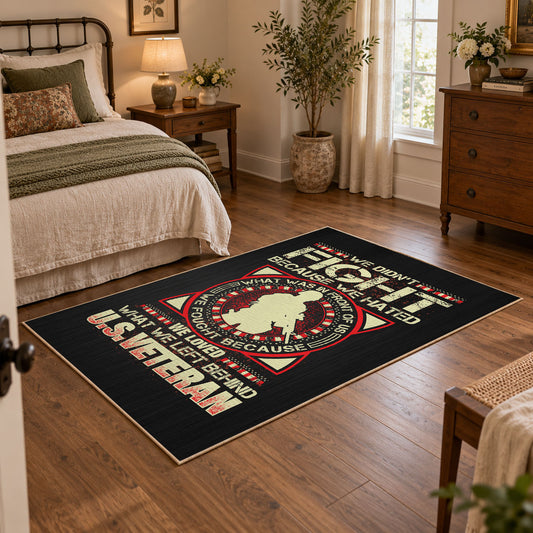 Military service emblem area rug in black, red, cream, and gold, featured room view