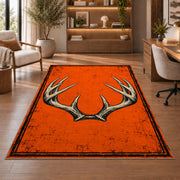 Blaze Orange Antlers rug in a home office with wooden shelves