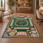 Green mahjong night rug with pink floral and tile borders in a sitting room