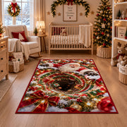 Santa appears above a deep red and green spiral edged with glowing golden lights; rug shown in a festive nursery