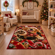A happy golden puppy in a Santa hat and red sweater raises a soft paw toward the viewer; rug shown in a festive nursery