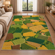 Patchwork Farm Fields Aerial rug in a bright living room with a sofa
