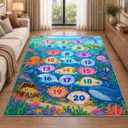 Blue ocean hopscotch rug with numbered bubbles, coral, fish and sea animals, styled in a warm furnished interior
