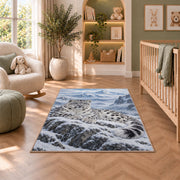 Snow Leopard Mountain Rug in a nursery with a crib and armchair