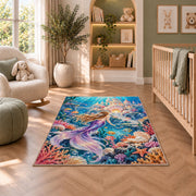 Underwater Castle Mermaid Rug in a nursery with a crib and armchair