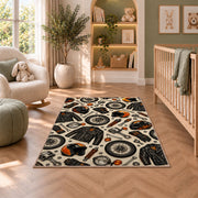 Biker Gear Pattern Rug in a nursery with a crib and armchair