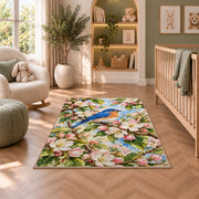 Bluebird on Blossom Branch Rug in a nursery with a crib and armchair