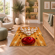 Bowling Pins Triangle Rug in a nursery with a crib and armchair