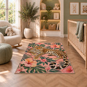Leopard on Pink Hibiscus Rug in a nursery with a crib and armchair