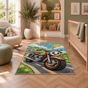 Cute Cartoon Motorcycle Kids Rug in a nursery with a crib and armchair