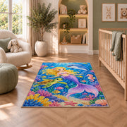 Mermaid and Ocean Friends Rug in a nursery with a crib and armchair