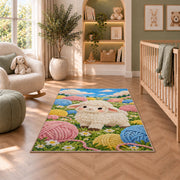 Sheep and Yarn Balls Rug in a nursery with a crib and armchair
