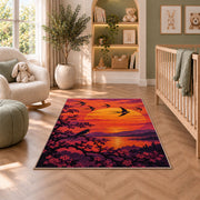 Birds at Sunset Rug in a nursery with a crib and armchair