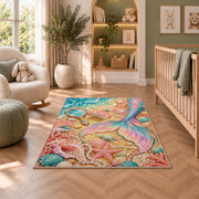 Mermaid Tail and Vanity Shells Rug in a nursery with a crib and armchair