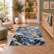 Leaping Snow Leopard Rug in a nursery with a crib and armchair