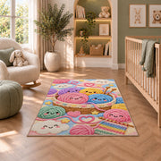 Happy Yarn Balls Nursery Rug in a nursery with a crib and armchair