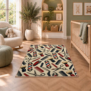 barber tools pattern rug in a nursery with a crib and armchair