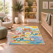 kids animal band rug in a nursery with a crib and armchair