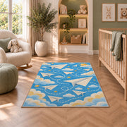 Paper Airplane Rug in a nursery with a crib and armchair