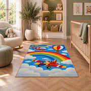 Rainbow Airplane Rug in a nursery with a crib and armchair