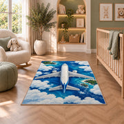 Airplane Top View Rug in a nursery with a crib and armchair