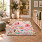 Axolotl Ice Cream Rug in a nursery with a crib and armchair