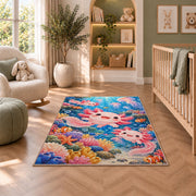 Axolotl Ocean Rug in a nursery with a crib and armchair