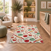 Baking tools pattern rug in a nursery with a crib and armchair