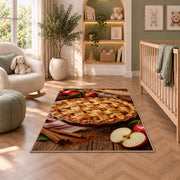 Apple pie rug in a nursery with a crib and armchair