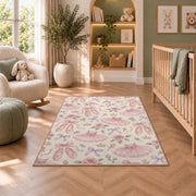 Ballet pattern rug in a nursery with a crib and armchair