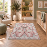 Pointe shoes harlequin rug in a nursery with a crib and armchair