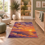 Books Flying at Sunset rug in a nursery with a crib and armchair