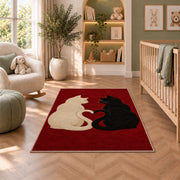 Cats with Heart Tails rug in a nursery with a crib and armchair