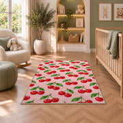 Cherry Pattern Rug in a nursery with a crib and armchair
