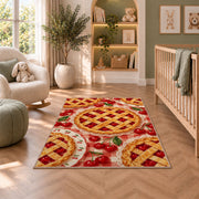Cherry Pie Rug in a nursery with a crib and armchair