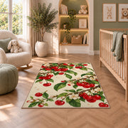 Cherry Branch Rug in a nursery with a crib and armchair