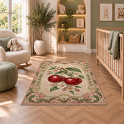 Cherry Arch Rug in a nursery with a crib and armchair