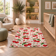 Cherry Heart Rug in a nursery with a crib and armchair
