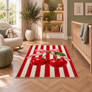 Candy Stripe Cherry Rug in a nursery with a crib and armchair