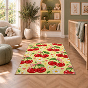 Kawaii Cherry Rug in a nursery with a crib and armchair