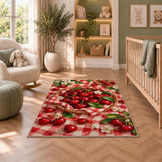 Cherry Picnic Rug in a nursery with a crib and armchair