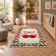 Cherry Border Rug in a nursery with a crib and armchair