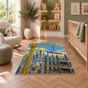 Tower Crane City Rug in a nursery with a crib and armchair