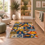 Construction Patchwork Rug in a nursery with a crib and armchair