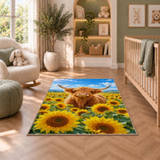 Highland Cow Sunflower Field Rug in a nursery with a crib and armchair