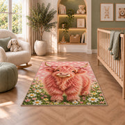 Pink Highland Cow Rug in a nursery with a crib and armchair