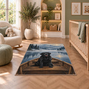 Black Lab in Rowboat rug in a nursery with a crib and armchair