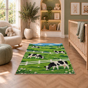 Dairy Cows by White Fence rug in a nursery with a crib and armchair